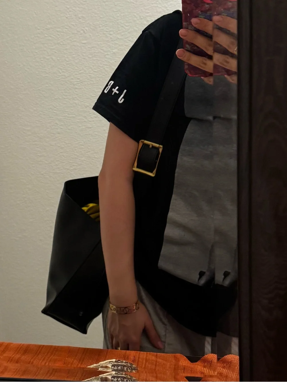 Elegant Black Leather Shoulder Bag with Gold Buckle